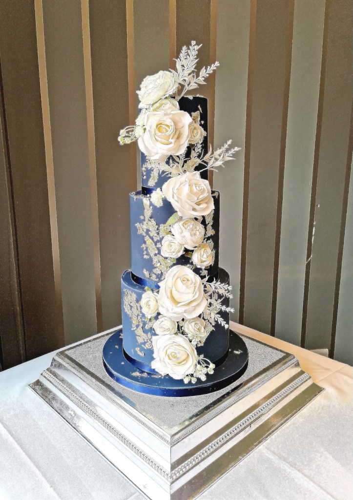 blue wedding cake with white roses