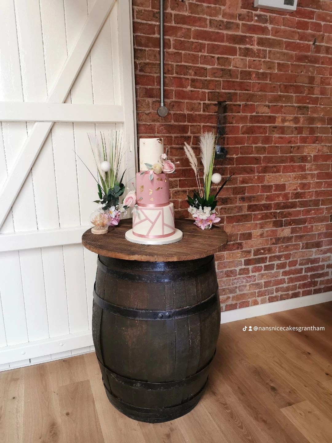 pink and white 3 tier wedding caake