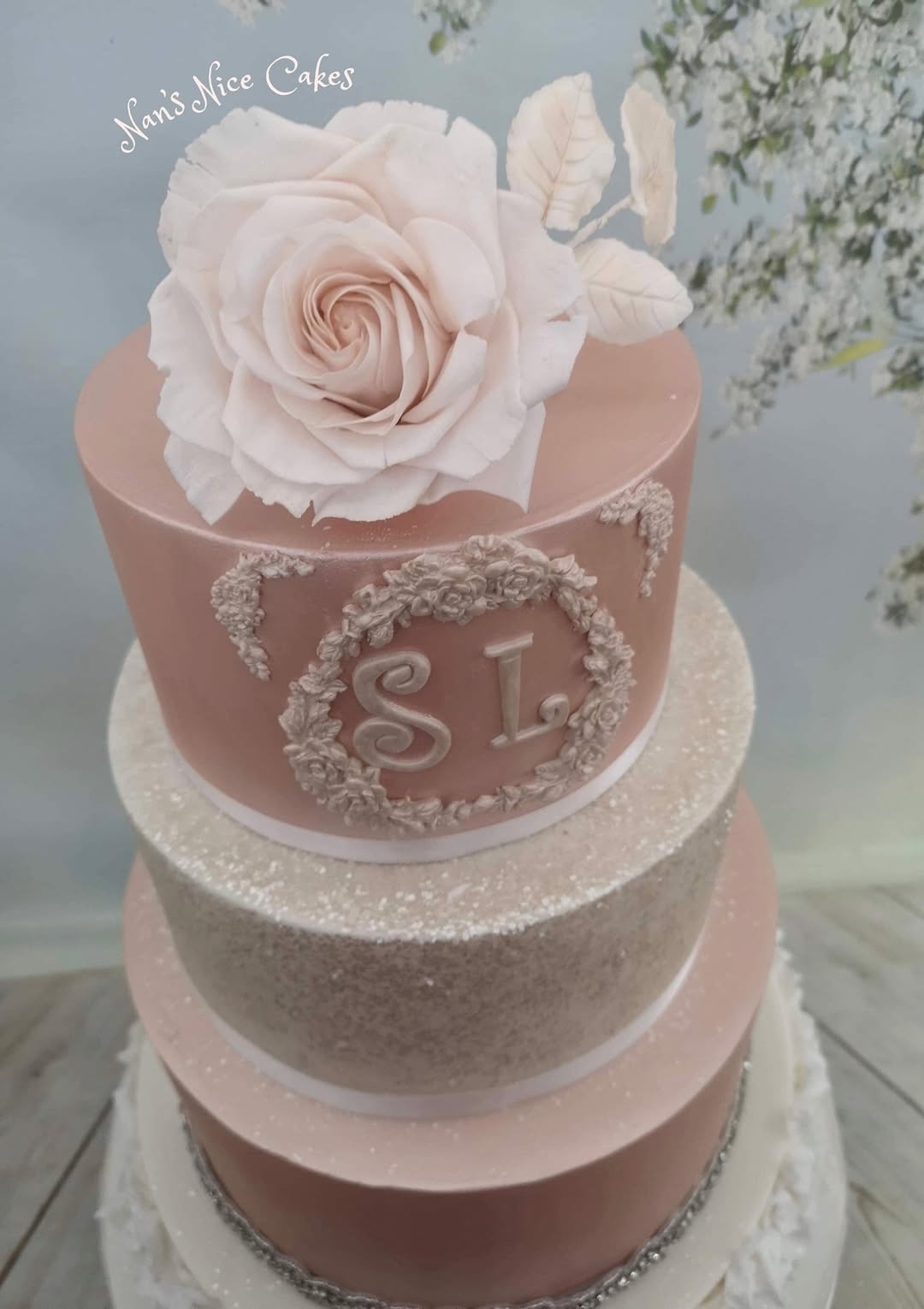 Pink Sparkly wedding cake with handmade roses