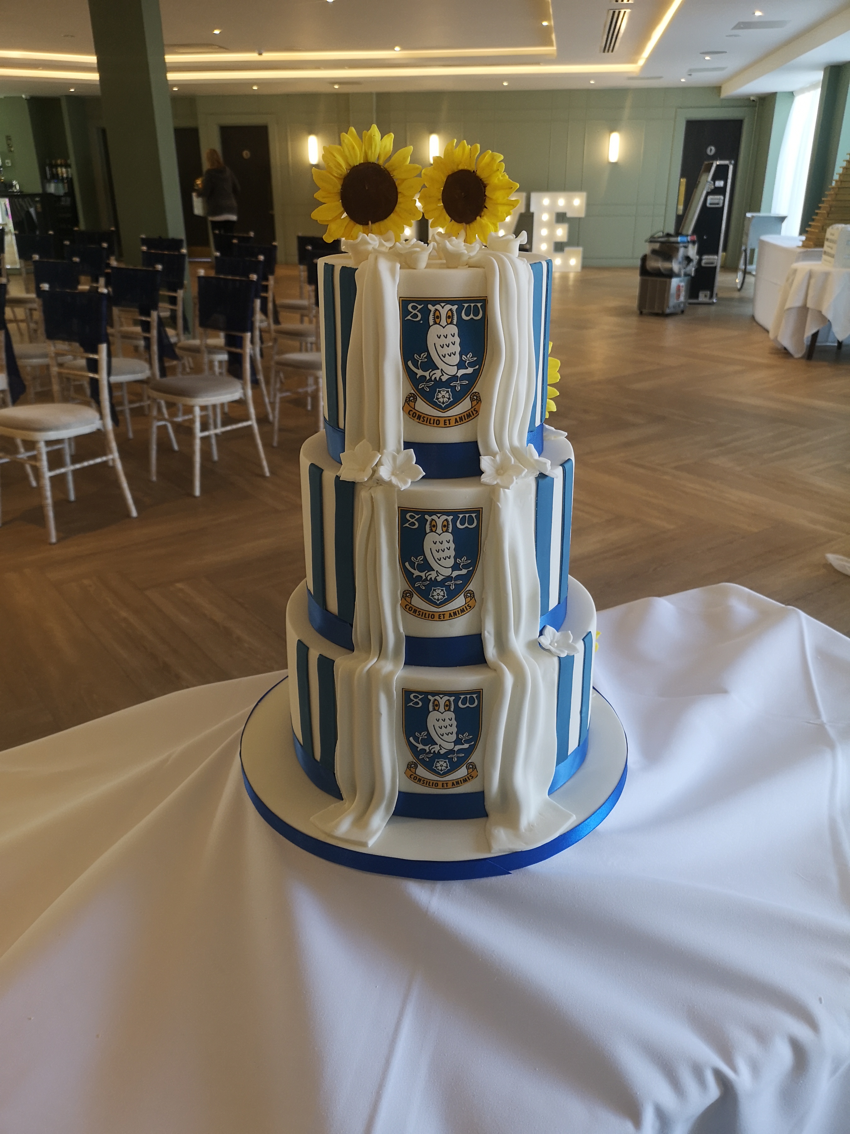 sunflower wedding cake with secret football back