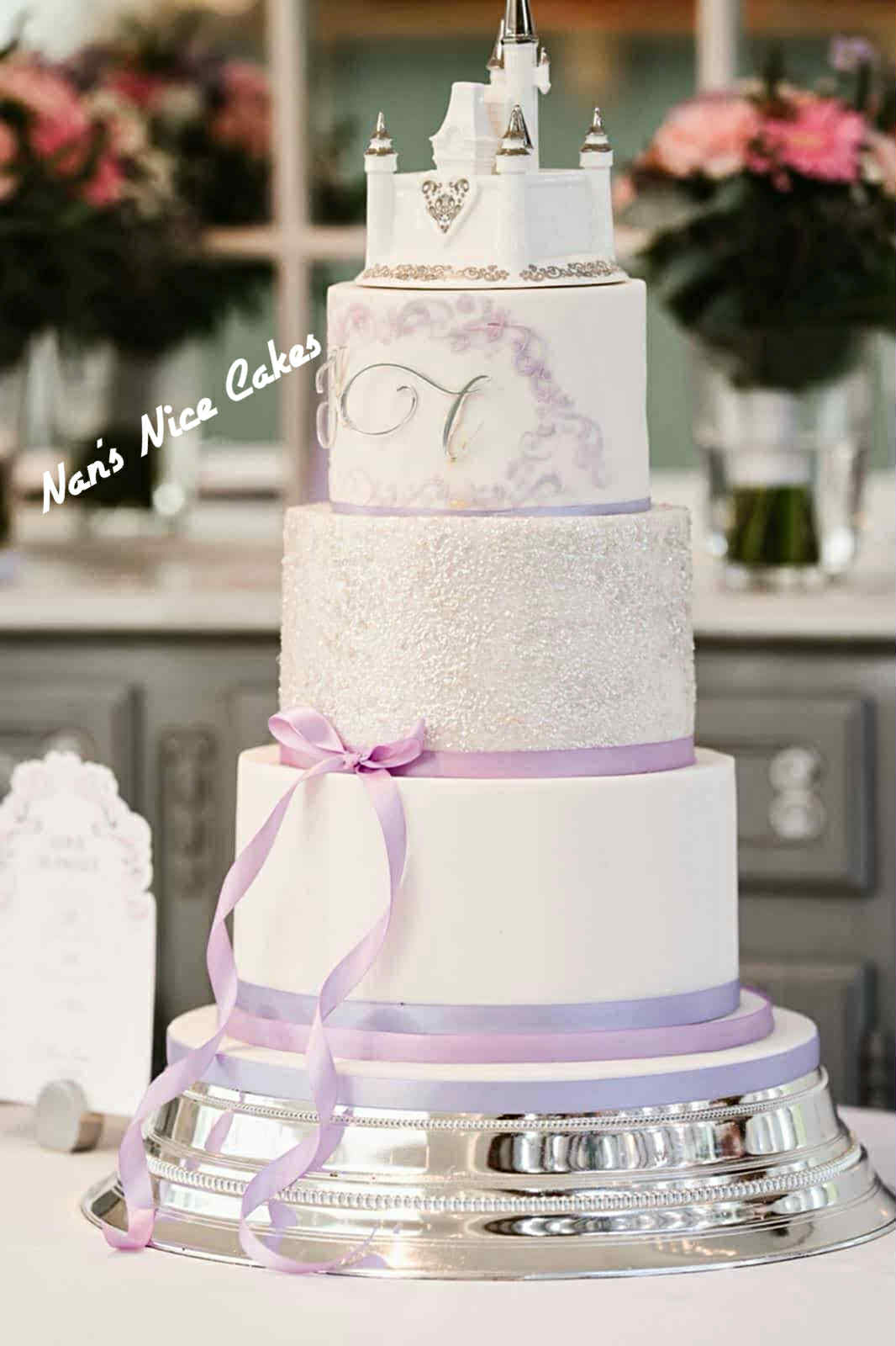 white and lilac princess castle wedding cake